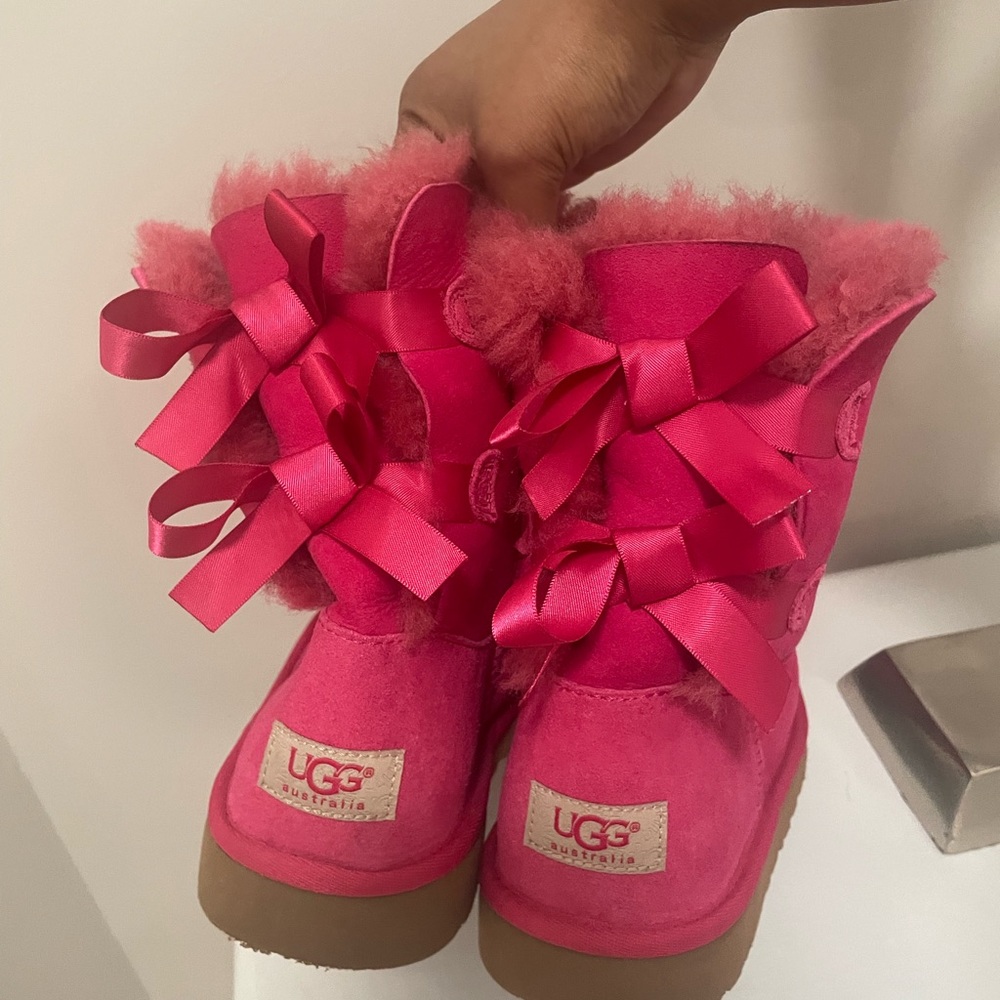 Pink UGG boots with bows
